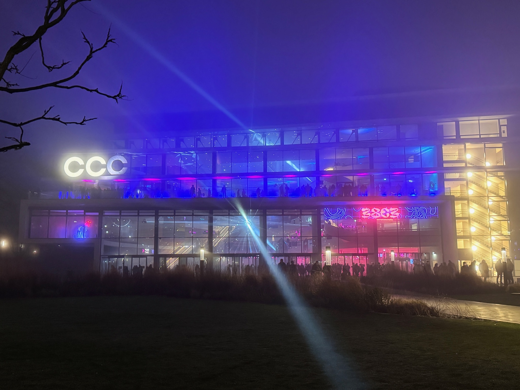 A photo, taken outside of the CCH during the 38C3, the building is surrounded by fog.