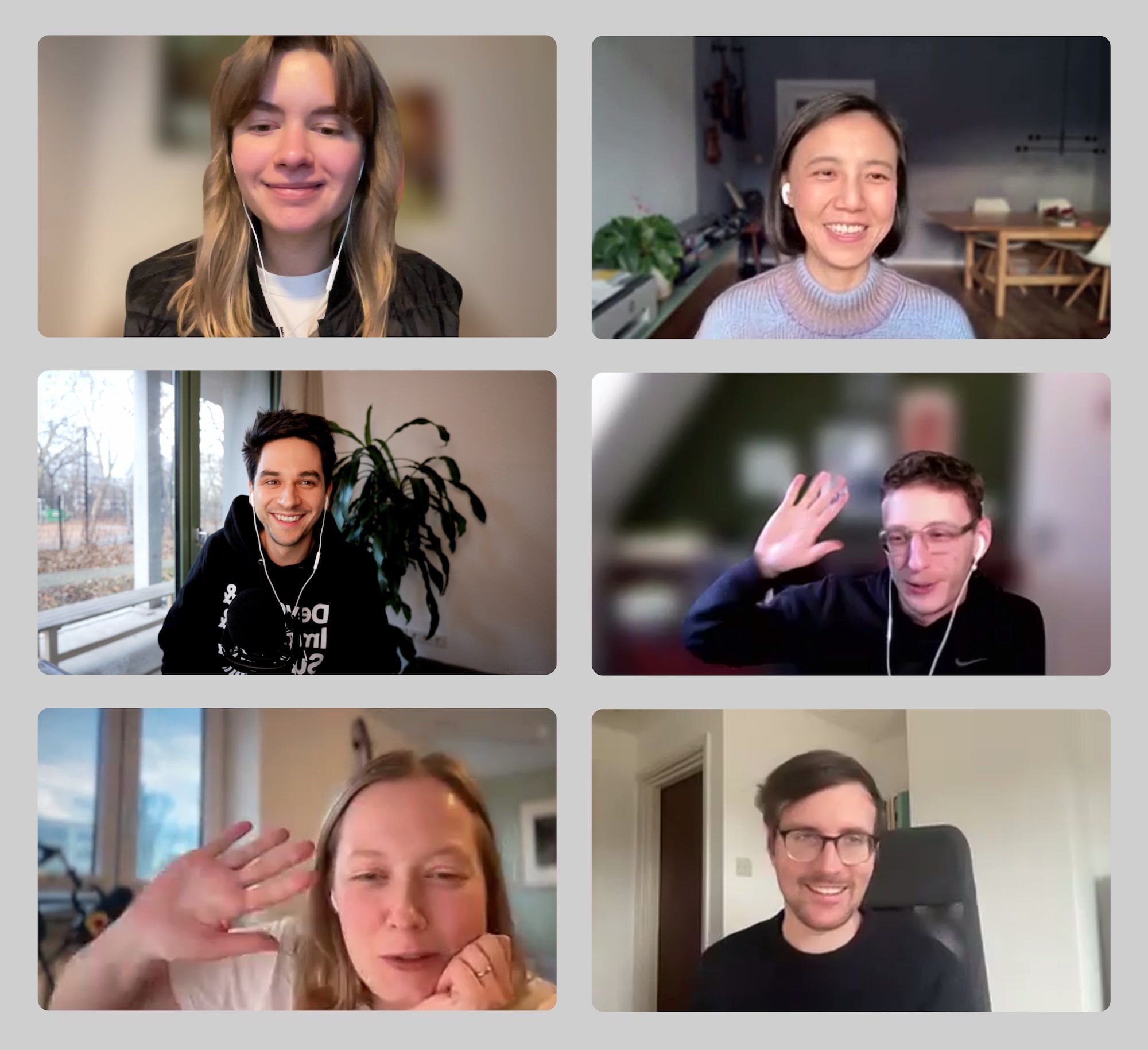 A screenshot of a zoom call with six people participating, half men, half women, some of them laughing, two of them waving